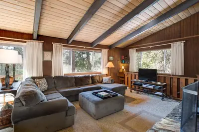 a living room with a couch and a television at 24B Birds Eye View in Wawona