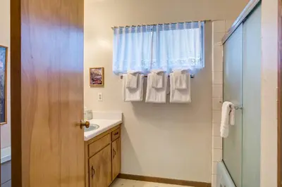 a bathroom with a sink and a shower at 2B Quail Meadow in Wawona