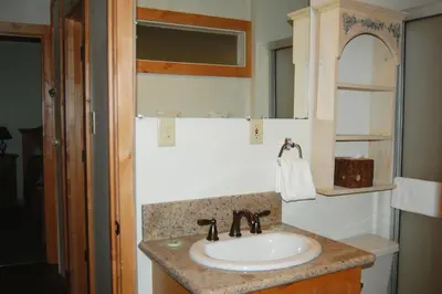 a bathroom with a sink and a mirror at 78 Ox Yoke in Wawona