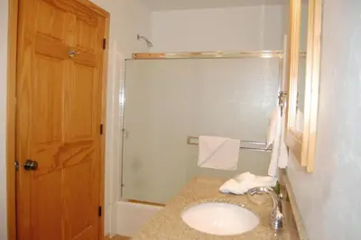 a bathroom with a sink and a shower at 9N Fox Hollow in Wawona