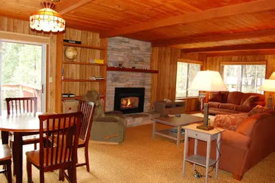 a living room with a couch and a fireplace at 43A Mountain Retreat in Wawona