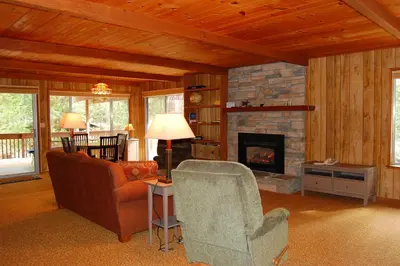 a living room with a couch and a fireplace at 43A Mountain Retreat in Wawona