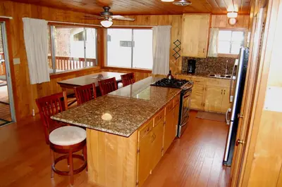 a kitchen with a center island in a house at 92 Harmony Villa in Wawona