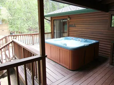 a large hot tub on a wooden deck at 93R Deer Lodge in North Wawona