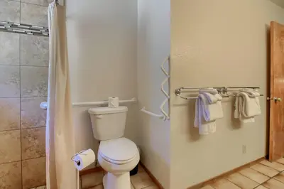 a bathroom with a toilet and a shower at 69 Bordentown West in Wawona