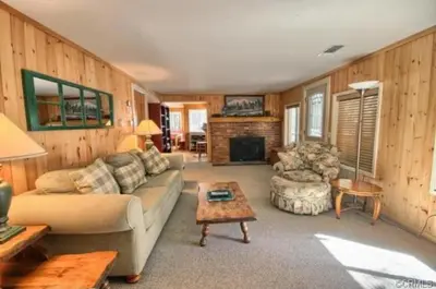 a living room with a couch and a table at 95R The Little Creek Cabin in Wawona