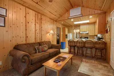 a living room with a couch and a table at 43R Edna's Hearts Desire in North Wawona