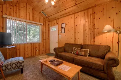 a living room with a couch and a coffee table at 43R Edna's Hearts Desire in North Wawona