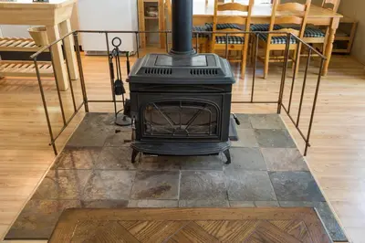 a stove sitting on a floor in a room at 7S Wawona Chalet in Wawona