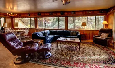 a living room with a couch and a table at 17A Longview in Wawona