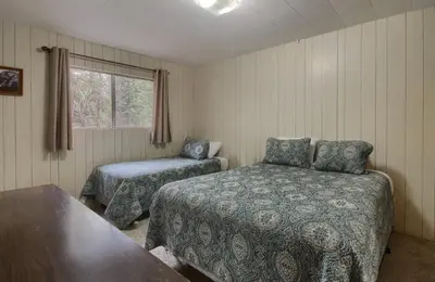 a bedroom with two beds and a window at 25A Villarreal Retreat in Wawona