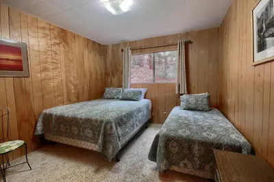a bedroom with two beds and a window at 25A Villarreal Retreat in Wawona