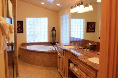 a bathroom with two sinks and a bath tub at 66 Grizzly Giant in Wawona