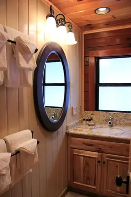 a bathroom with a mirror and a sink at 66 Grizzly Giant in Wawona