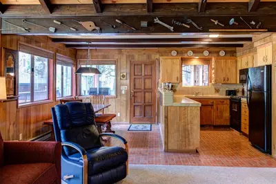 a kitchen with a couch and a chair in a room at 4B Mountain Memory in Wawona