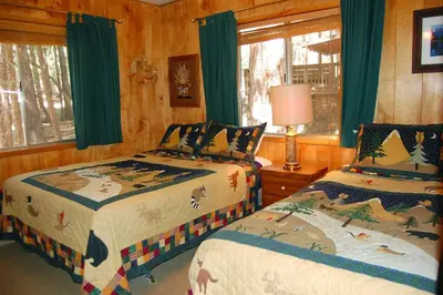 a bedroom with two beds and a window at 82 Shehadey's Retreat in North Wawona