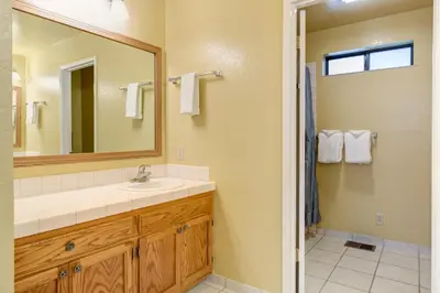 a bathroom with a sink and a mirror at 1 Cabin Among the Firs in Wawona