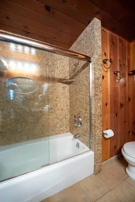 a bathroom with a tub and a toilet at 48 Sugar Pine Suite in North Wawona