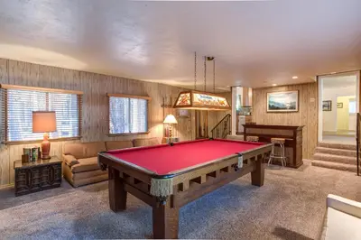 a room with a pool table and a piano at 81 Ashbaugh Meadow in North Wawona