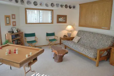 a living room with a couch and a table at 18A Pohono Pines in Wawona
