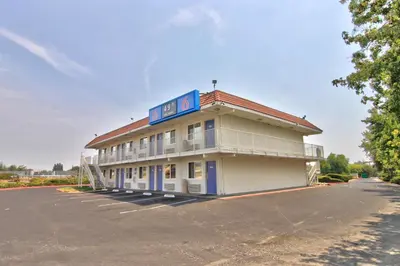 a building with a sign on the side of it at Motel 6-Sacramento, CA - North in Sacramento