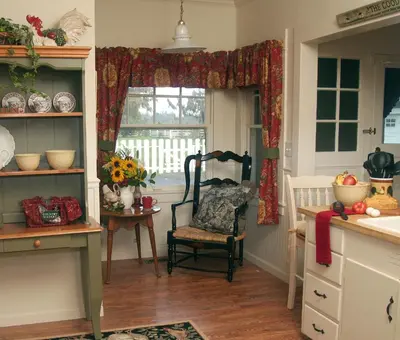 a kitchen with a chair and a window at Cottage on Armstrong in Lodi