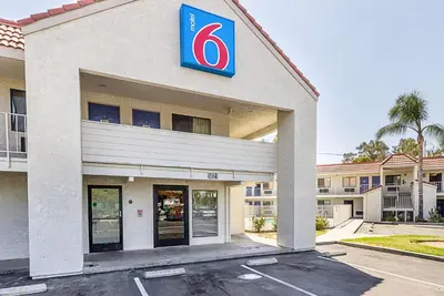 a building with a sign on the side of it at Motel 6-Fresno, CA in Fresno