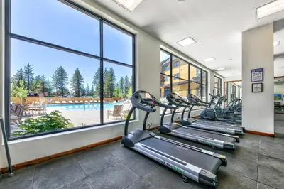 a row of treadmills in a gym with a large window at Zalanta, A Vail Resorts Property in South Lake Tahoe