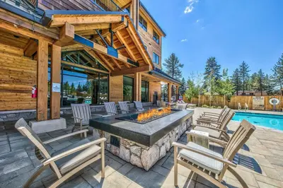 an outdoor patio with chairs and a fire pit at Zalanta, A Vail Resorts Property in South Lake Tahoe