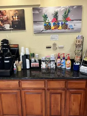 a counter in a coffee shop with drinks on it at Days Inn by Wyndham Turlock in Turlock