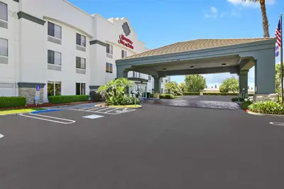 a rendering of a hotel with a parking lot at Hampton Inn & Suites Modesto - Salida in Modesto