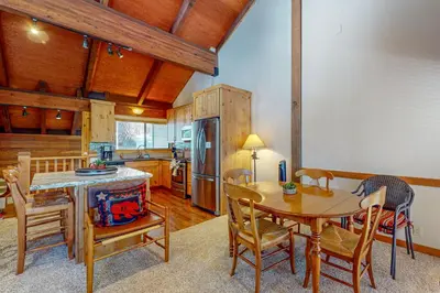 a kitchen and dining room with a table and chairs at Indian Hills Hideaway in Ponderosa Fairway Estates