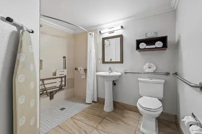 a bathroom with a toilet and a sink at Comfort Inn South San Jose - Morgan Hill in Morgan Hill