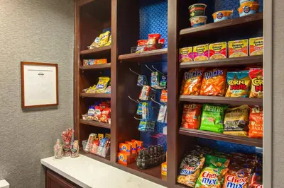 a refrigerator filled with lots of different types of food at Hampton Inn and Suites Merced in Merced