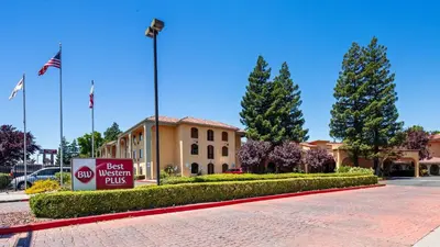 a best western plus building with a sign in front of it at Best Western Plus Heritage Inn in Stockton