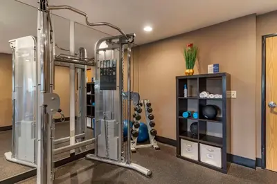 a fitness room with a gym with tread machines at Best Western Plus Vineyard Inn in Livermore
