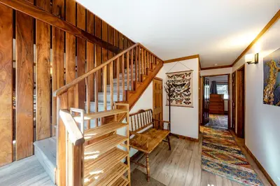 a staircase in a home with wooden walls at Mammoth Pines 11 in Mammoth Lakes