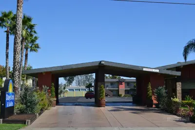 a parking garage in front of a hotel at Days Inn & Suites by Wyndham Lodi in Lodi