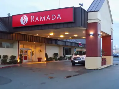 a car parked in front of a rambala store at Ramada by Wyndham Sacramento in Sacramento