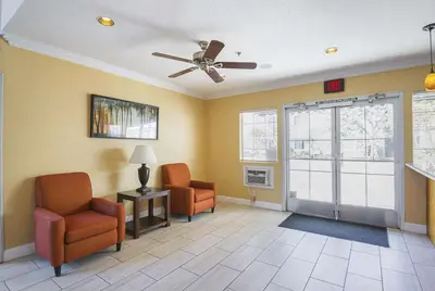 a waiting room with two chairs and a ceiling fan at Quality Inn Fresno Yosemite Airport in Fresno
