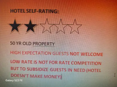 a sign with four stars on top at University Square Hotel in Fresno