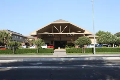 a building on the side of a street at University Square Hotel in Fresno