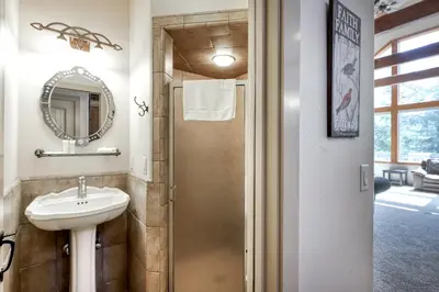 a bathroom with a sink and a mirror at Alderhill in Shaver Lake
