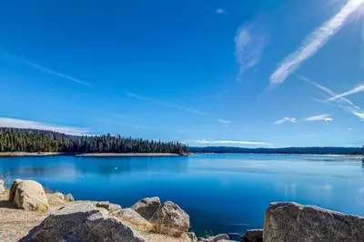 a view of a large blue lake with trees at Eagle's Landing Condo 68 in Lakeshore