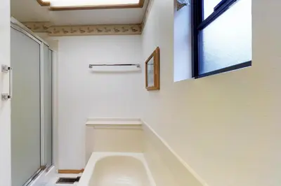 a bathroom with a toilet and a window at Foxtail Delight in Dora Belle