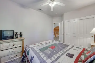 a bedroom with a bed and a tv on a dresser at Hatcher's Hideaway in Shaver Lake