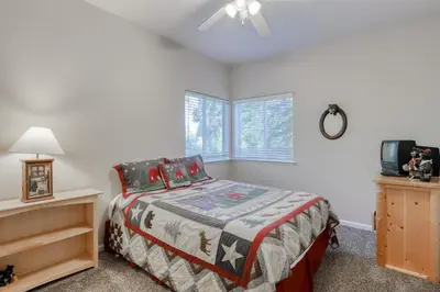 a bedroom with a bed and a tv in it at Hatcher's Hideaway in Shaver Lake