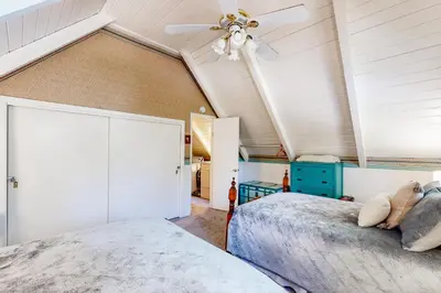 a bedroom with a bed and a ceiling fan at Mountain Memories in Shaver Lake