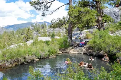 a group of people swimming in a river at Mountain Memories in Shaver Lake