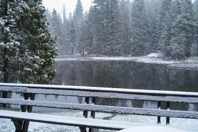 a view of a lake in the snow at Water's Edge Retreat in Shaver Lake